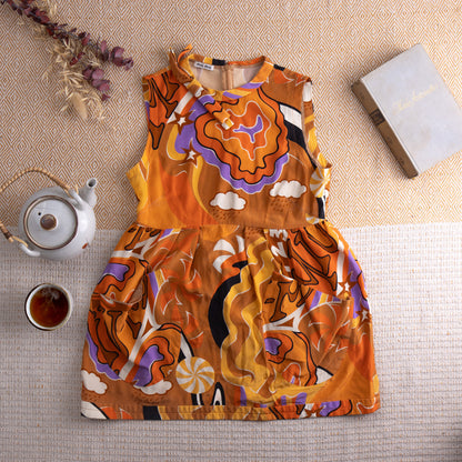 Vintage Miu Miu Silk Tunic Top – vibrant orange silk with psychedelic mod print featuring swirling clouds, stars, eyes, mushrooms and abstract shapes in purple, black and white, jewel neckline with ruffle trim, sleeveless, back zip, baby doll silhouette, Miu Miu label, flat lay editorial shot