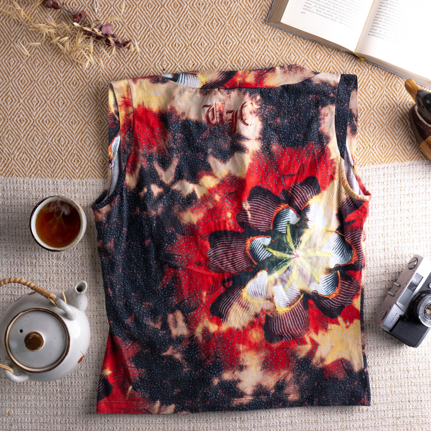 back view Vintage Versace Jeans Couture 90s Y2K Floral Gothic Print Tank Top – dark abstract floral print in crimson red, black, sand and yellow on cotton, deep V-neckline, sleeveless, relaxed boxy fit, Versace Jeans Couture label, ITTIERRE Made in Italy archival designer, flat lay editorial shot