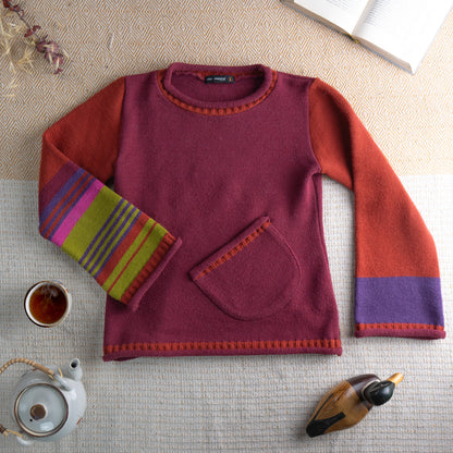 Archival Cop Copine Paris Y2K "RHIN" Colorblock Knit Sweater – burgundy body with rust orange raglan sleeves, multicolour stripe cuffs in yellow, pink, purple and blue, contrasting orange picot trim at neckline and hem, single front kangaroo pocket, avant-garde Made in France, flat lay editorial shot