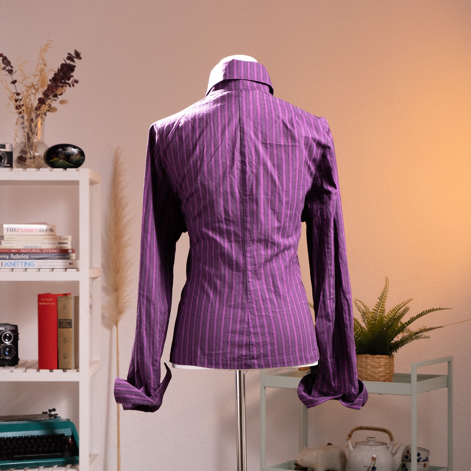 back view Archival Marimekko Ritva Falla Y2K Doubleface Cotton Striped Blouse – deep purple with tonal white pinstripe, point collar, long sleeves with button cuffs, silver snap button-front, fitted silhouette, minimalist unisex oversized Scandinavian design, product shot on dress form
