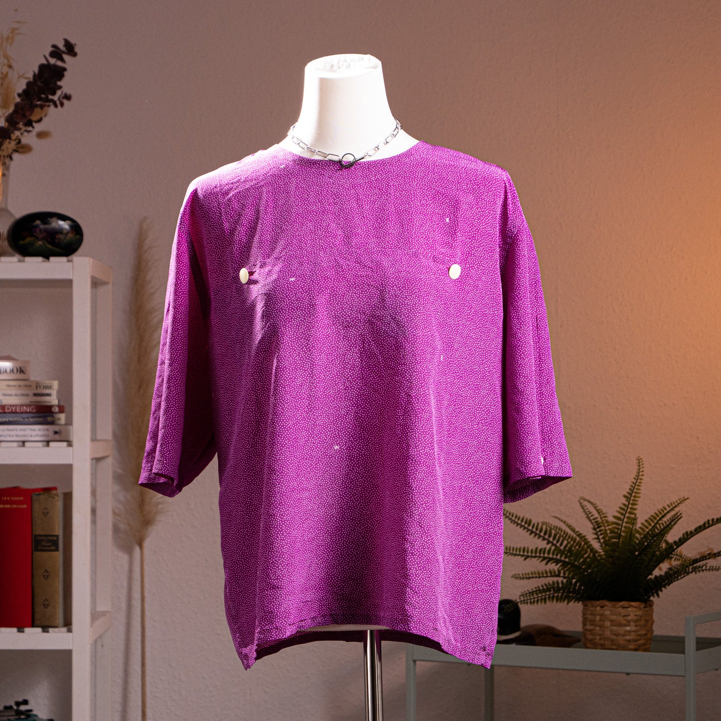 Archival Nina Ricci 90s Reversible Front-to-Back Blouse – magenta purple silk with all-over white micro dot print, round neckline, short sleeves, oversized boxy tunic silhouette, mother-of-pearl snap button side details for two-way reversible wear, product shot on dress form