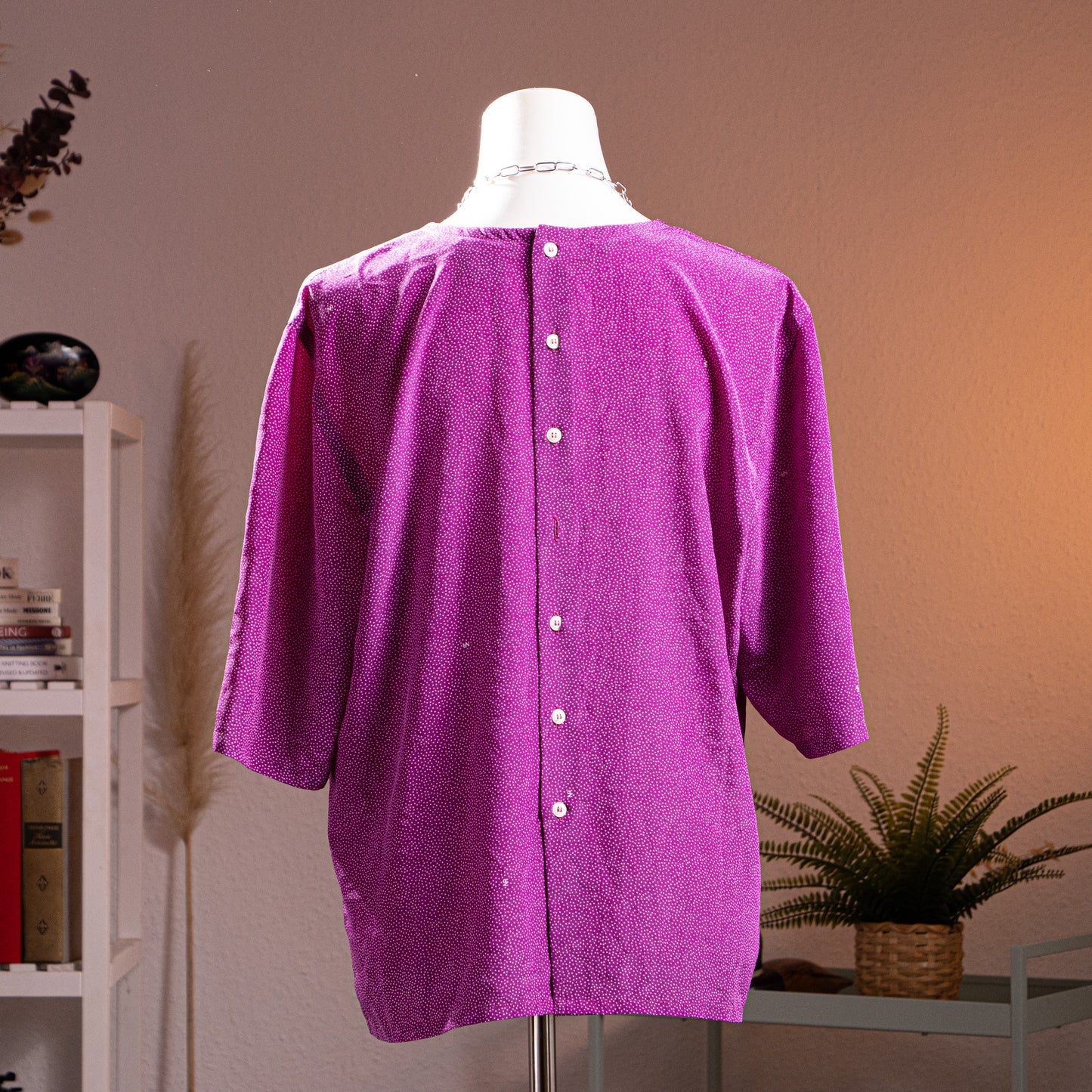 back view Archival Nina Ricci 90s Reversible Front-to-Back Blouse – magenta purple silk with all-over white micro dot print, round neckline, short sleeves, oversized boxy tunic silhouette, mother-of-pearl snap button side details for two-way reversible wear, product shot on dress form