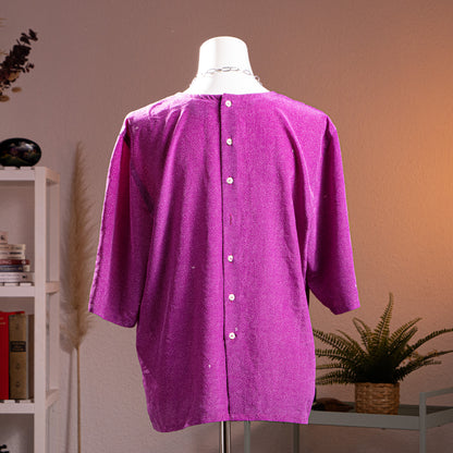 back view Archival Nina Ricci 90s Reversible Front-to-Back Blouse – magenta purple silk with all-over white micro dot print, round neckline, short sleeves, oversized boxy tunic silhouette, mother-of-pearl snap button side details for two-way reversible wear, product shot on dress form
