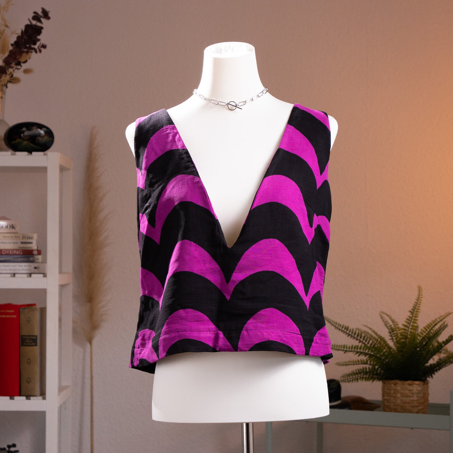 Archival Marimekko Y2K "Lokki" Wave Print Reversible Vest by Samu-Jussi Koski – bold fuchsia pink and black large-scale wave/seagull print on virgin wool and silk, deep V-neckline, sleeveless cropped silhouette, reversible avant-garde Scandinavian design, product shot on dress form