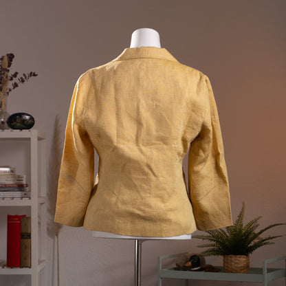 back view NOS Archival Kenzo Jungle Paris Deadstock 90s Yellow Linen Blazer – warm golden yellow linen, notch lapel, single-breasted with three mother-of-pearl buttons, 3D hummingbird and floral appliqué at lower front, long sleeves, fitted silhouette, product shot on dress form