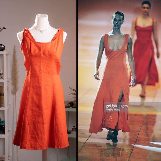 Museum Gianni Versace SS 1993 Runway Dress in orange linen – square neckline with gathered shoulder detail, A-line silhouette, sleeveless, shown on dress form alongside original SS1993 runway photo of Emma Sjöberg Wiklund walking the Versace show