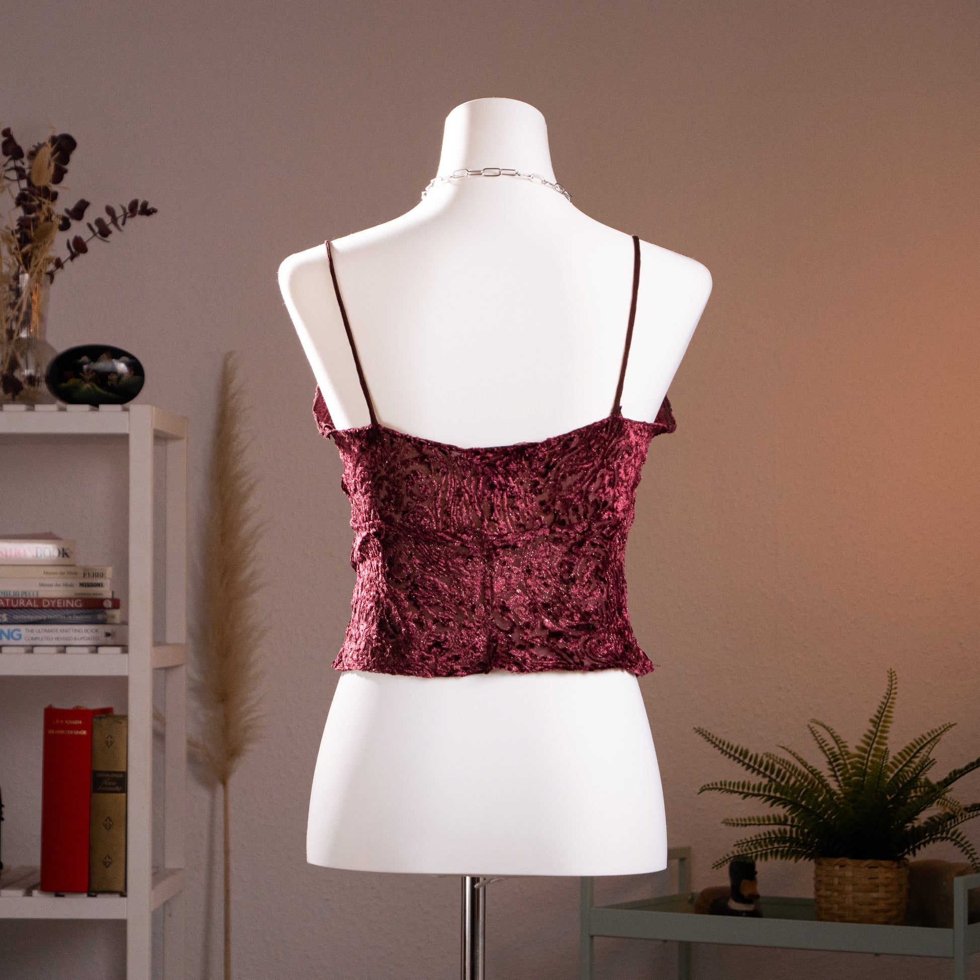 Rear profile view of the vintage Lolita Lempicka burgundy burnout velvet top on a mannequin, showing the low-slung horizontal neckline architecture and parallel micro-fine spaghetti straps.