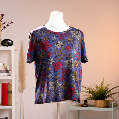 Front view of authentic 1980s Gucci marine life all-over print unisex t-shirt on a white mannequin showing fish and coral motifs.