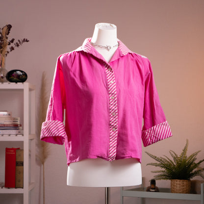Three-quarter front view of vintage late 1980s Lanvin fuchsia cropped blouse showing the architectural slub cotton texture.