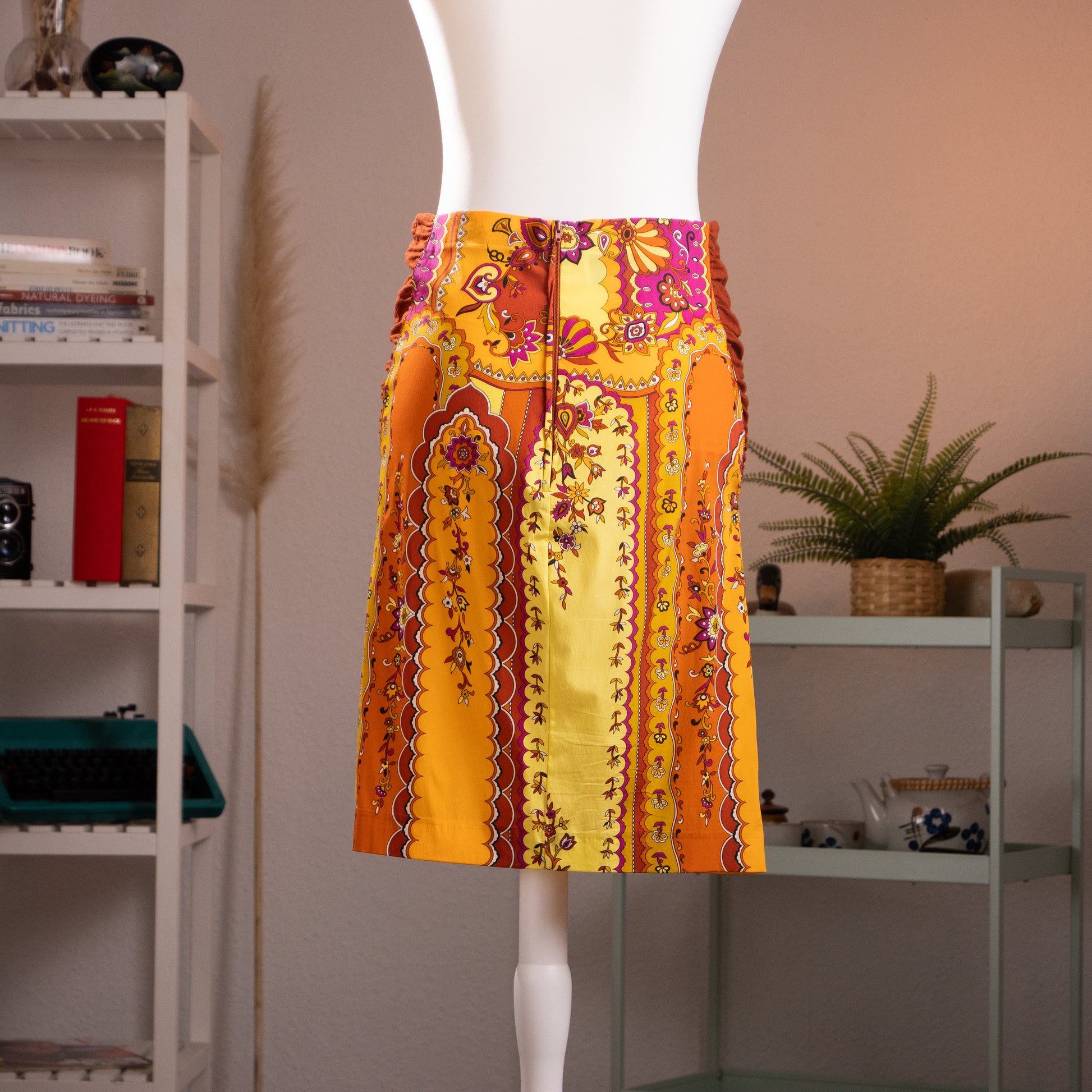 rear view of archival Anna Molinari Blumarine silk midi skirt highlighting the detailed elasticated vertical ruched side panels at the waist