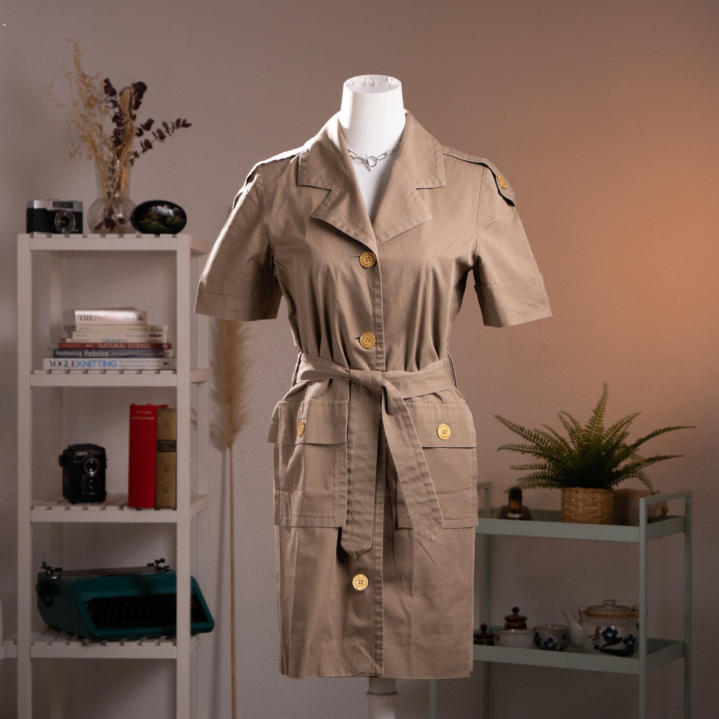 Full-length front view of the structured archival Givenchy utility dress showing the matching waist belt and symmetric cargo pockets.