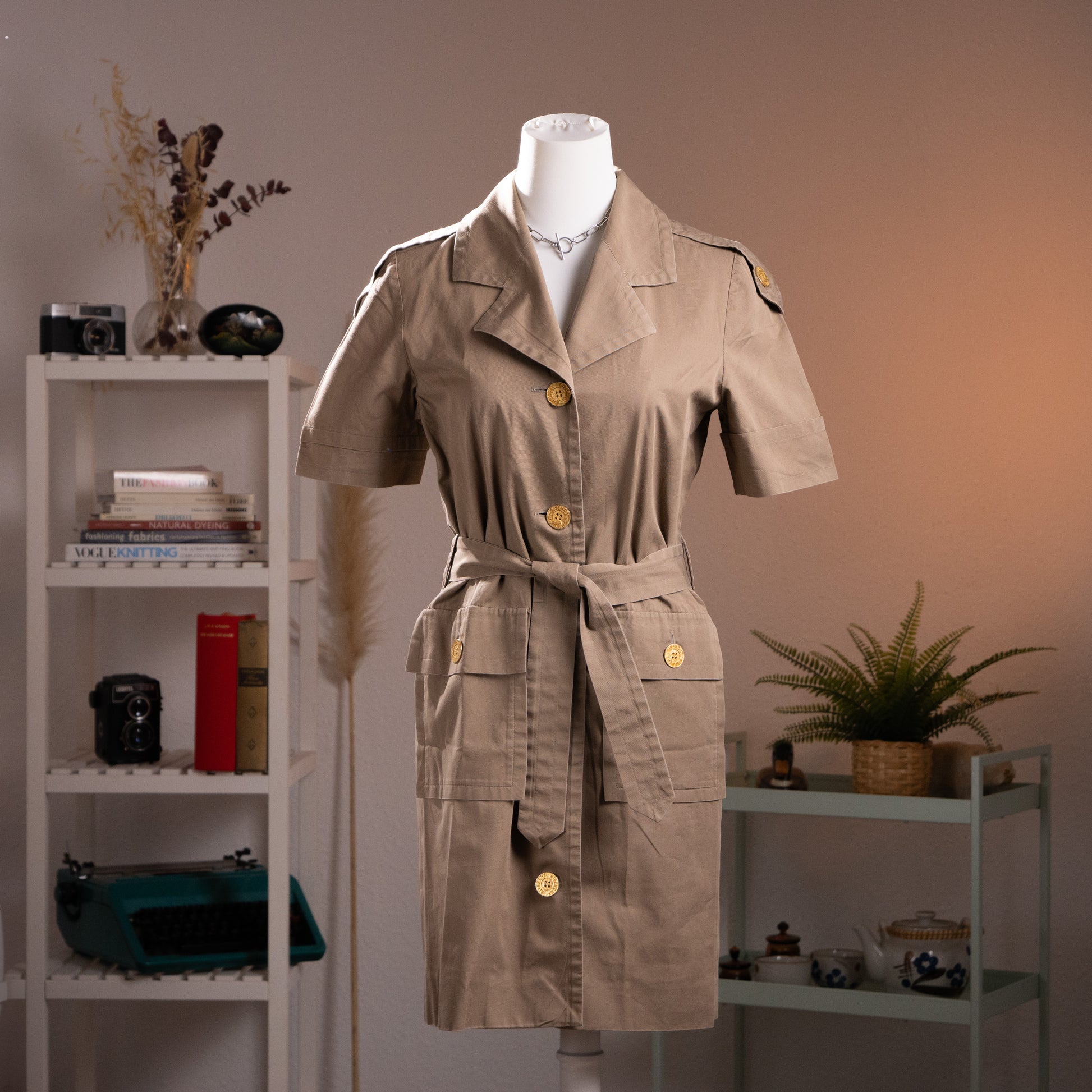 Full-length front view of the structured archival Givenchy utility dress showing the matching waist belt and symmetric cargo pockets.